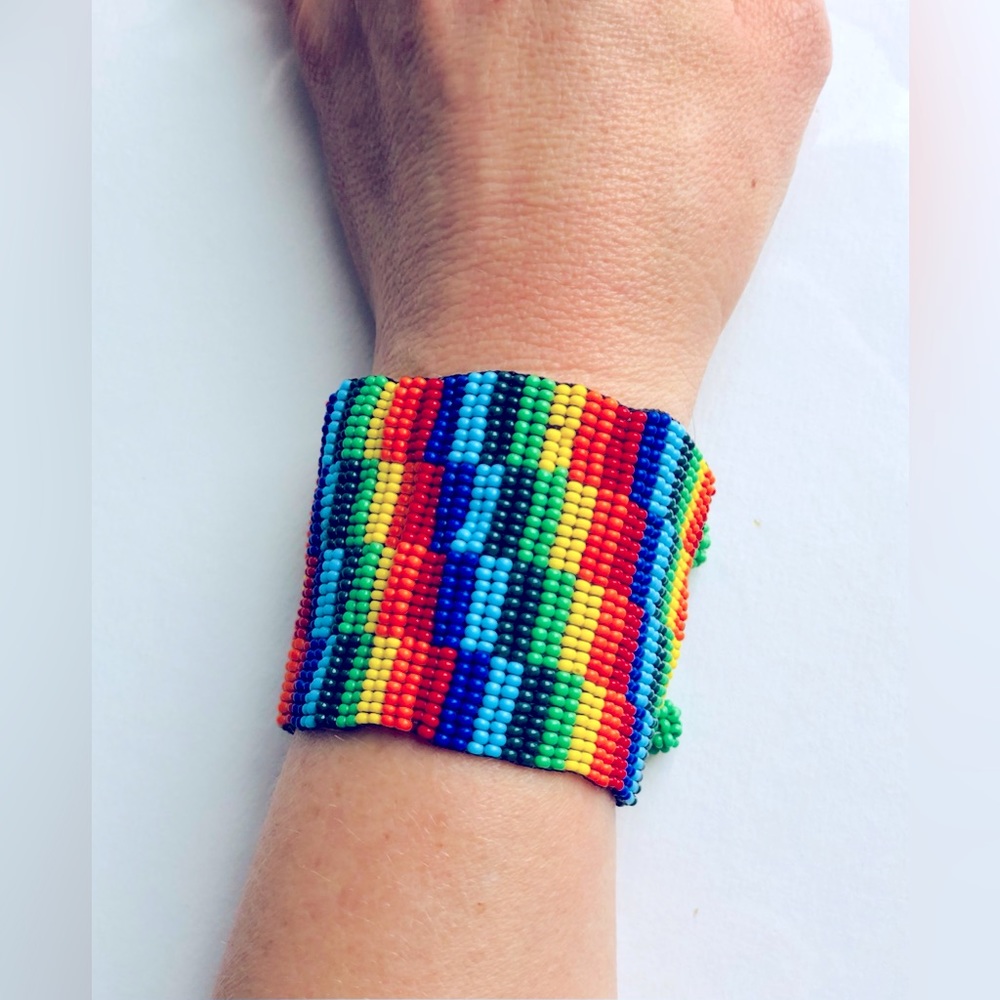 Eye-catching cuff bracelet handmade in Mexico. Geometric design, rainbow colors.